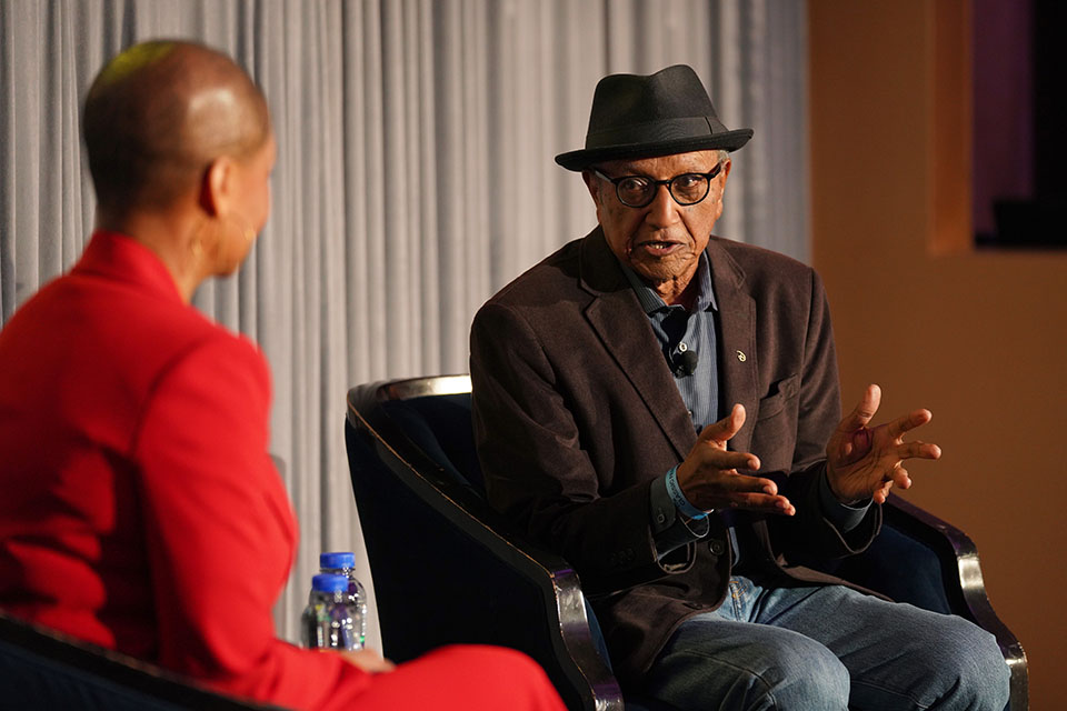 Jacqueline Stewart and Floyd Norman speak onstage in 2022.