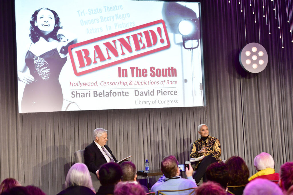 David Pierce and Shari Belafonte speak onstage at the